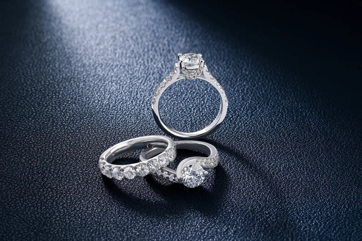 Close-up of elegant diamond engagement and wedding rings highlighting fine craftsmanship and luxury.